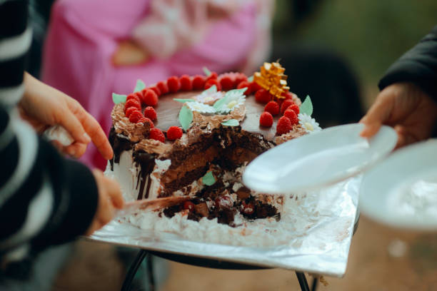 istock People Cutting a Chocolate Raspberry Cake at Home Anniversary 2195598566