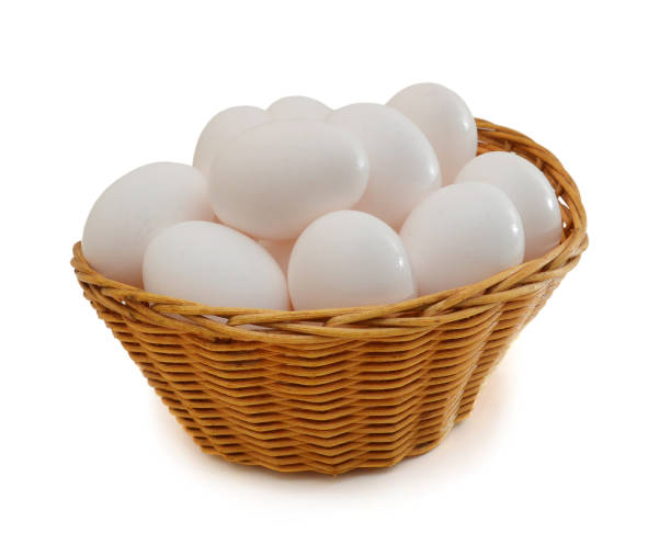 istock Many eggs in basket isolated on white 2195599316