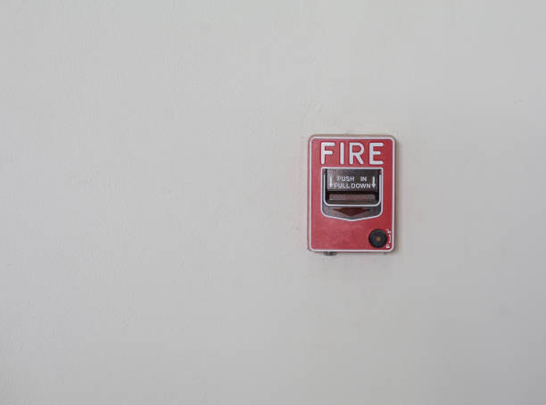 istock Fire alarm button for the building is installed on a white wall. 2195600856