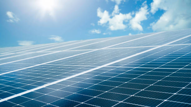 istock Photovoltaic solar power panel on blue sky and sunlight background. Green clean alternative and renewable energy concept. 2195607692