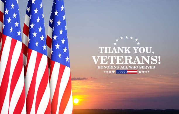 istock Veterans Day Background Design. USA flags against the sunset 2195608494