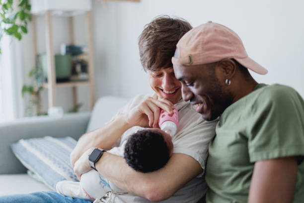 istock Gay dads giving their baby a bottle 2195608969