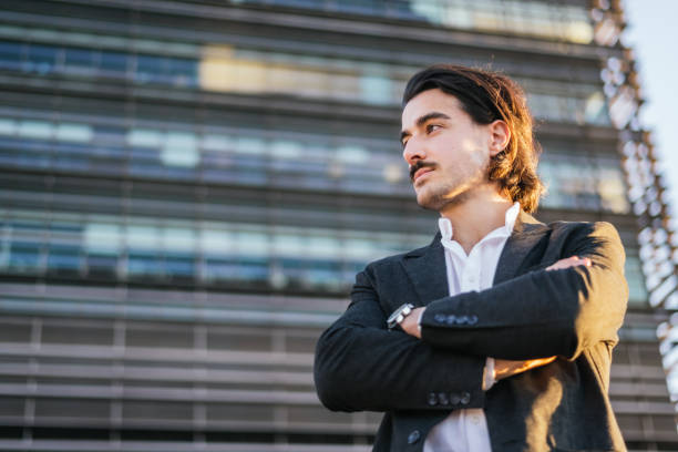 istock Confident And Handsome Businessman Portrait – Professional Executive Look Representing Success And Leadership In Business. 2195611363