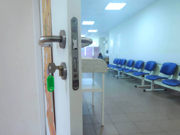 istock Empty corridor in hospital with chairs. Hospital hallway. 2195613123