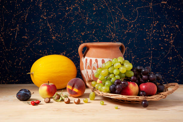 istock Still life, pumpkins, ceramic pot, and various fruits 2195614601