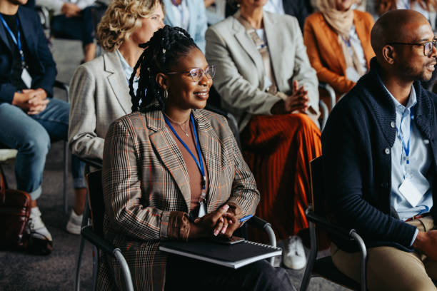 istock Business conference with diverse audience listening to presentation 2195619201