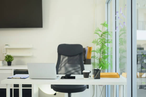 istock Modern office space with an organized desk, laptop, coffee cup, and stationery 2195619698