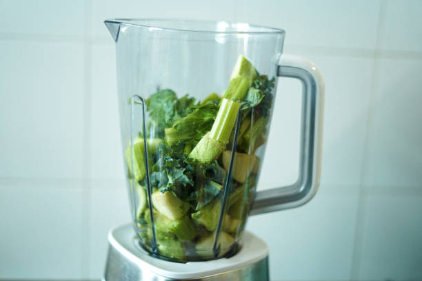 istock Green vegetables and fruits in a blender, 2195620968