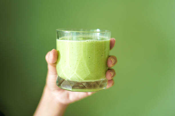 istock Green vegetable and fruit juice glass handle 2195621084