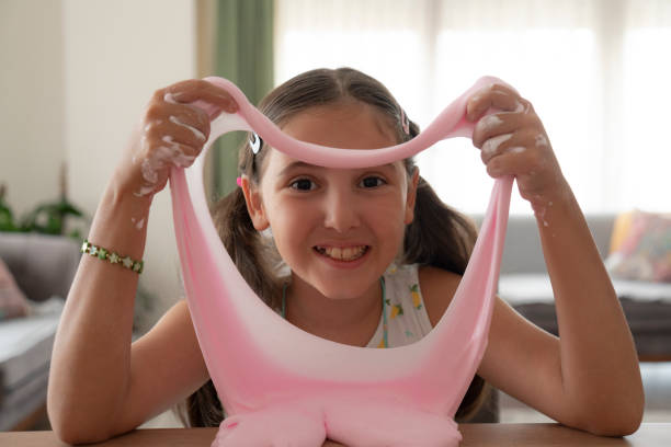 istock Girl playing with slime 2195621685