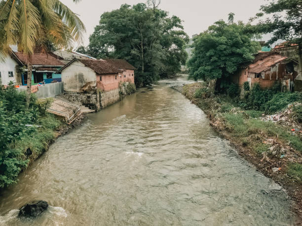 istock view of a river flowing through a village in East Java, Indonesia 2195622161