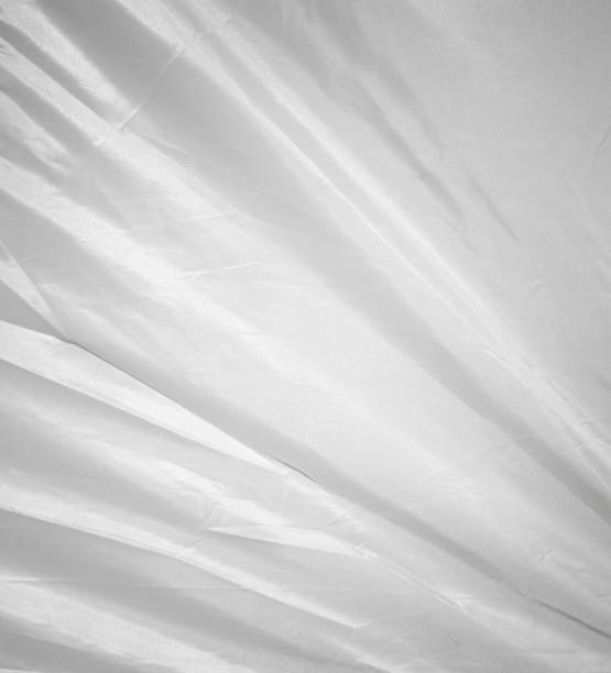 istock White wavy fabric texture from tents or canvas. Abstract  curved fabric background. 2195624094