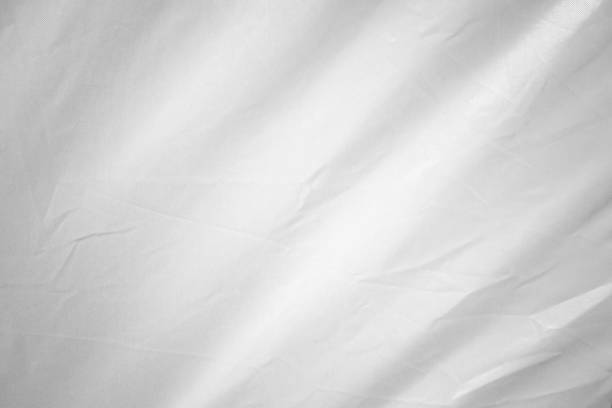 istock White wavy fabric texture from tents or canvas. Abstract  curved fabric background. 2195624095