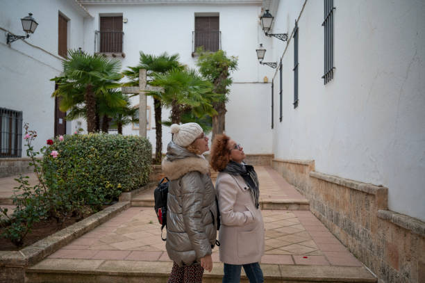 istock Two senior women exploring a historical courtyard while admiring architectural details, during a village cultural tour 2195624202