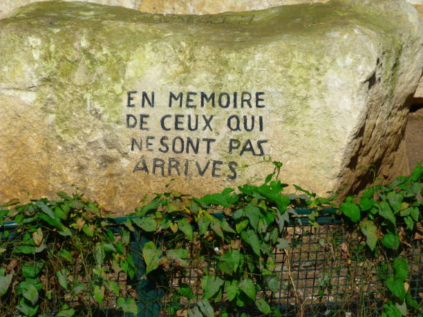 istock In memory of those who did not arrive, anonymous inscription on a stone in tribute to missing migrants, Paris, France 2195624534