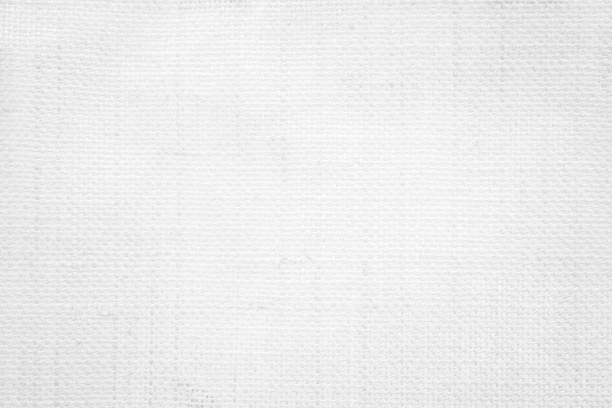 istock White color fabric canvas woven texture background in pattern light blank. Natural gauze linen, carpet wool and cotton cloth textile textured as clean empty for decoration text. Grey sack material. 2195626941
