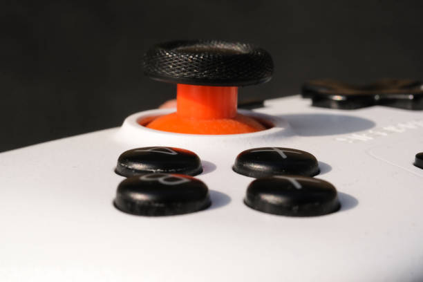 istock Closeup of orange joystick and dial buttons 2195627287