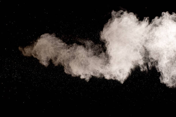 istock White powder explosion isolated on black background.White dust particles splash. 2195627479