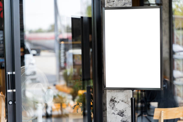 istock Mockup white poster with black frame stand in front of blur restaurant cafe background for show. 2195628554