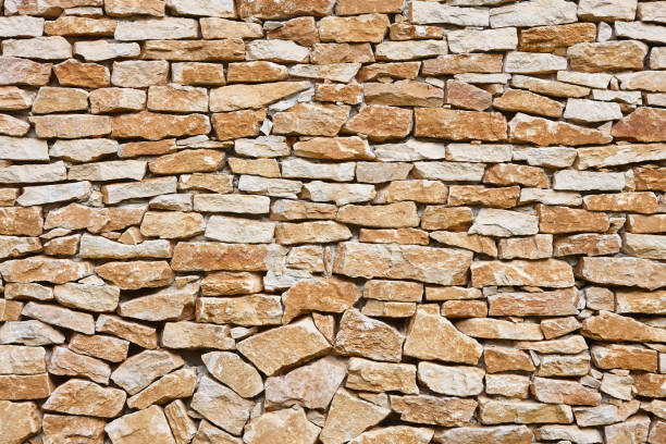 istock Stone textured wall in brown color. Natural rocky background. Horizontal 2195629629