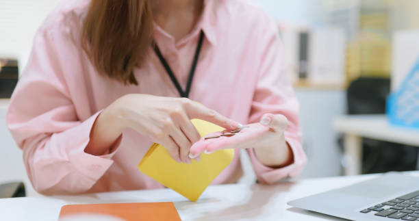 istock businesswoman look empty wallet 2195632288