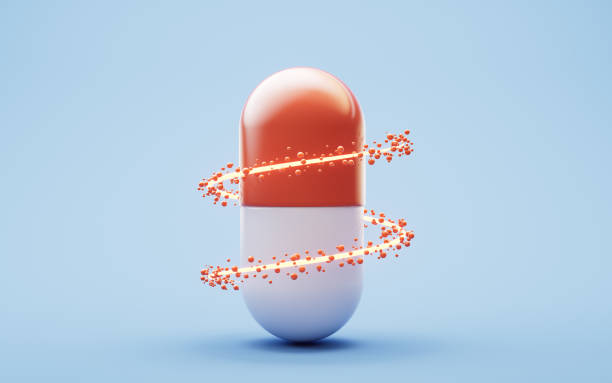 istock Medical capsule and flowing particles, 3d rendering. 2195634134