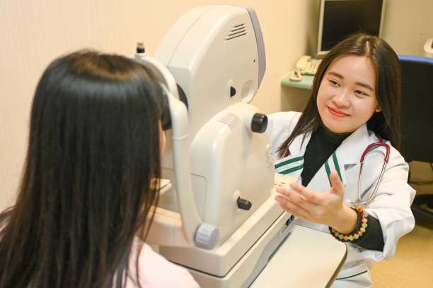 istock Ophthalmologist Examining  woman patient using a non-mydriatic retinal camera 2195638993