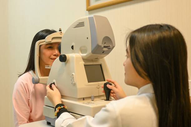 istock Ophthalmologist Examining  patient using a non-mydriatic retinal camera 2195639010