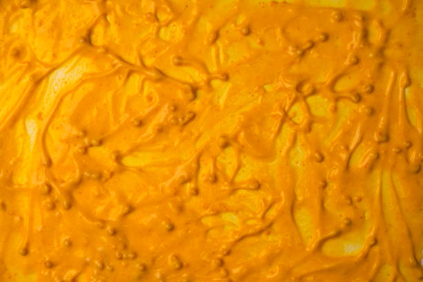 istock Yellow sauce splashes as a background. 2195642528