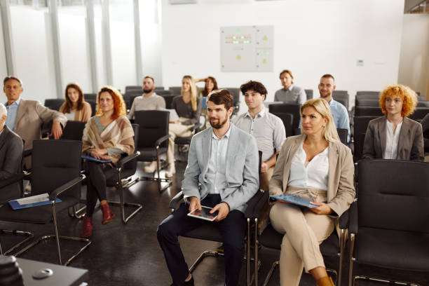 istock Business people attending a seminar in board room. 2195644944