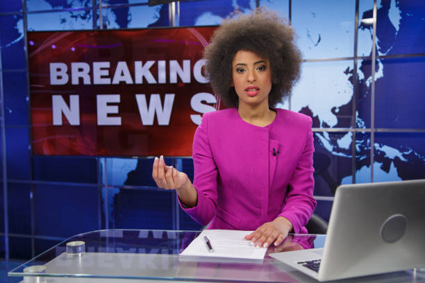 istock Breaking news female anchor 2195645692