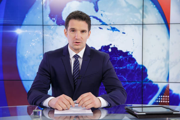 Man sitting in news studio. Today's news story.
