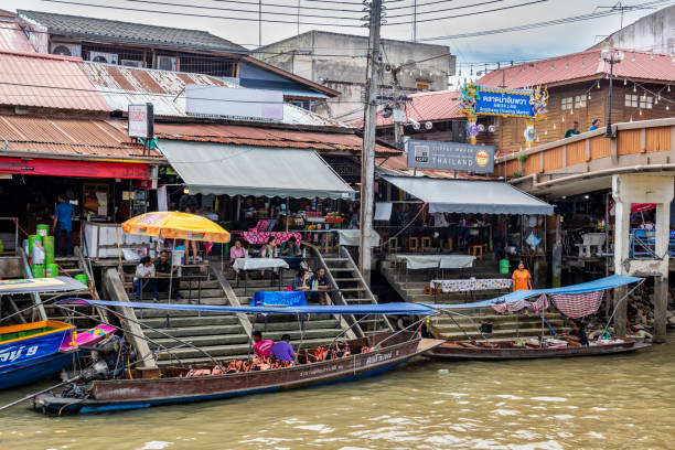Amphawa, Thailand - July 5, 2024: Amphawa floating market in Samut Songkhram, Thailand. It is one of the most popular floating markets in Thailand.