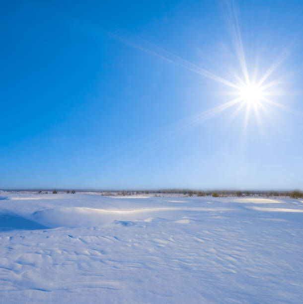 istock wide snowbound plain at the sunny winter day 2195646312