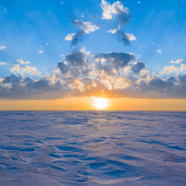 istock wide snowbound plain at the sunset, winter outdoor evening scene 2195647345