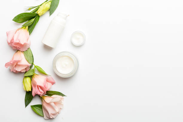 istock Composition with cosmetic products and beautiful roses on white background. Copy space, flat lay 2195649269