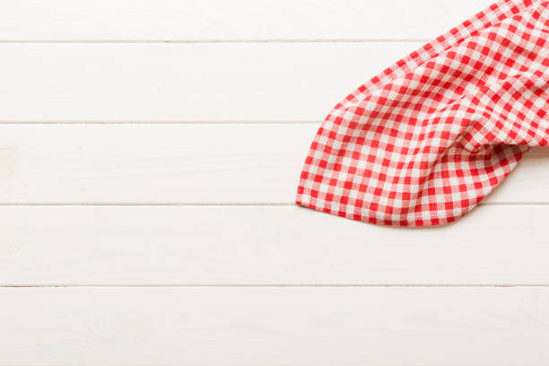 istock top view with red empty kitchen napkin isolated on table background. Folded cloth for mockup with copy space, Flat lay. Minimal style 2195649345