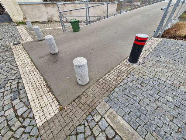 istock Retractable automatic bollards and other parking bollards serve to reliably secure public spaces and effectively prevent entry into pedestrian zones or other areas with limited motor vehicle access 2195649517