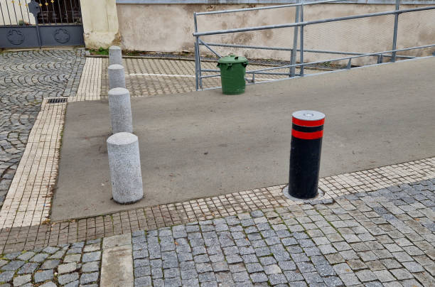 istock Retractable automatic bollards and other parking bollards serve to reliably secure public spaces and effectively prevent entry into pedestrian zones or other areas with limited motor vehicle access 2195649917