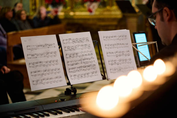 istock Concert performance featuring sheet music in an elegant church setting 2195650160
