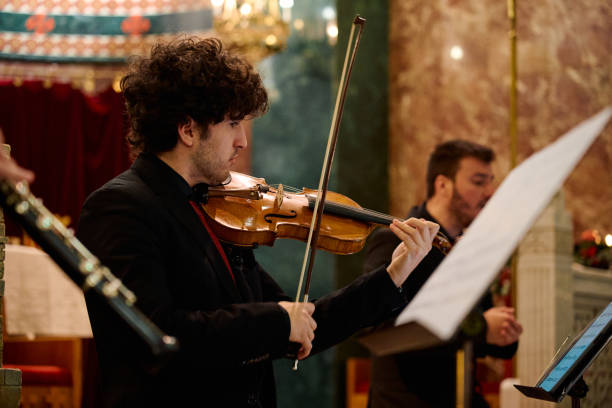istock Musicians performing classical music during a concert in a church setting 2195650302