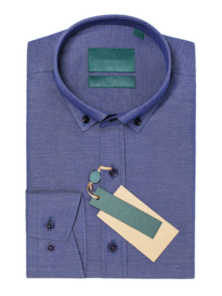 Folded shirts in different colors  and casual sport shoes on white background