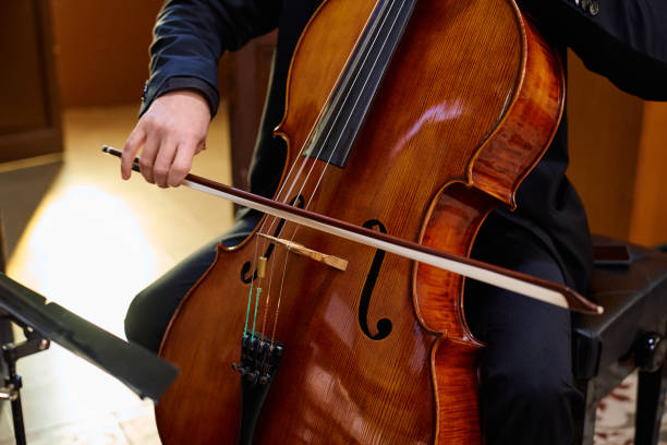 istock Cellist performing a soulful piece in a tranquil church setting 2195650545