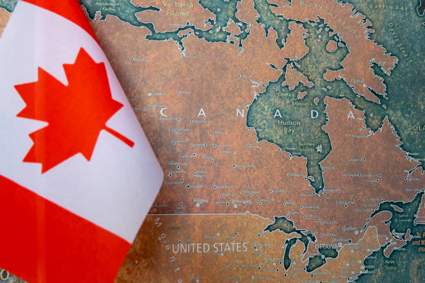 istock Canada national flag on the paper world map. 2195652263