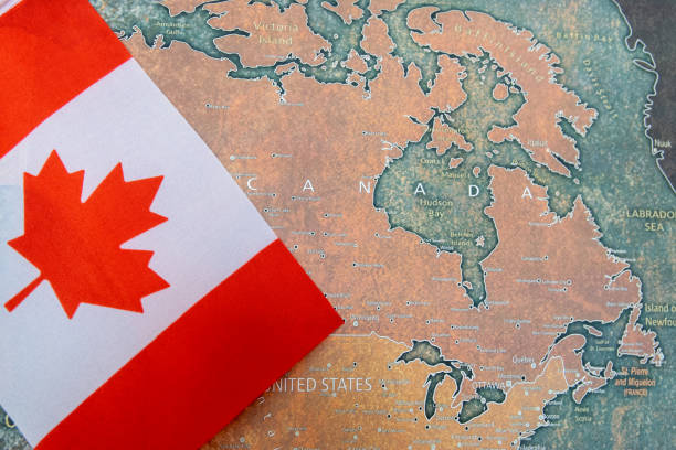 istock Canada national flag on the paper world map. 2195652272