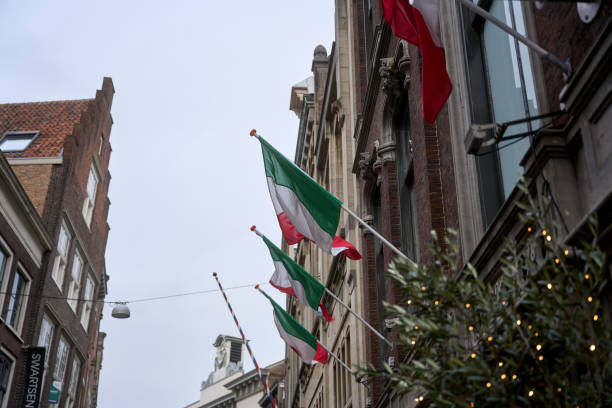 istock Italian flags waving from a building in amsterdam, netherlands 2195653088