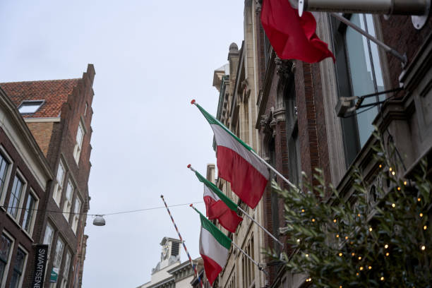 istock Italian flags waving on a building in amsterdam, netherlands 2195653126