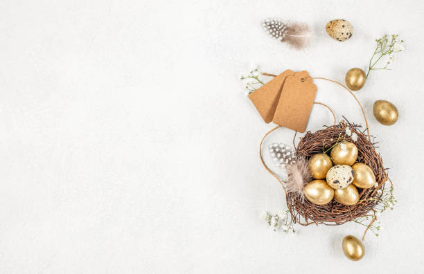 istock Easter quail eggs in a nest. Easter zero waste, eco friendly decoration, eggs and flowers. Easter festive greeting card. Top view, copy space 2195656315