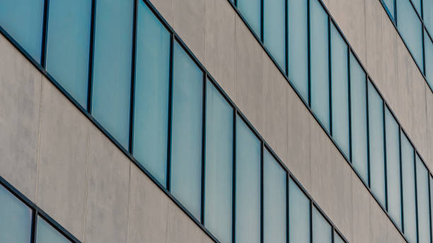 istock many empty windows of a gray concrete building 2195657543