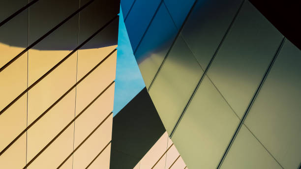istock walls of a high orange modern building 2195657590